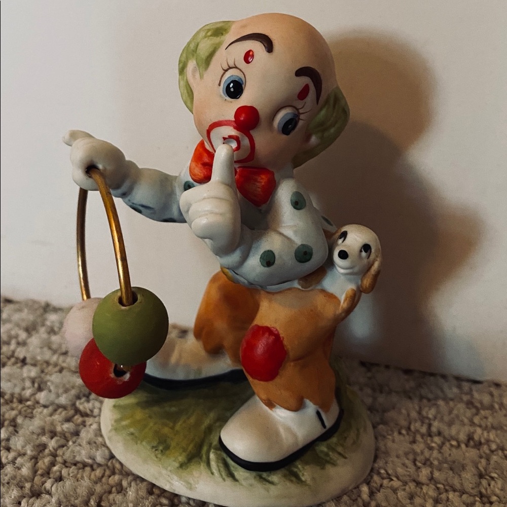 Clown and dog porcelain figurine.